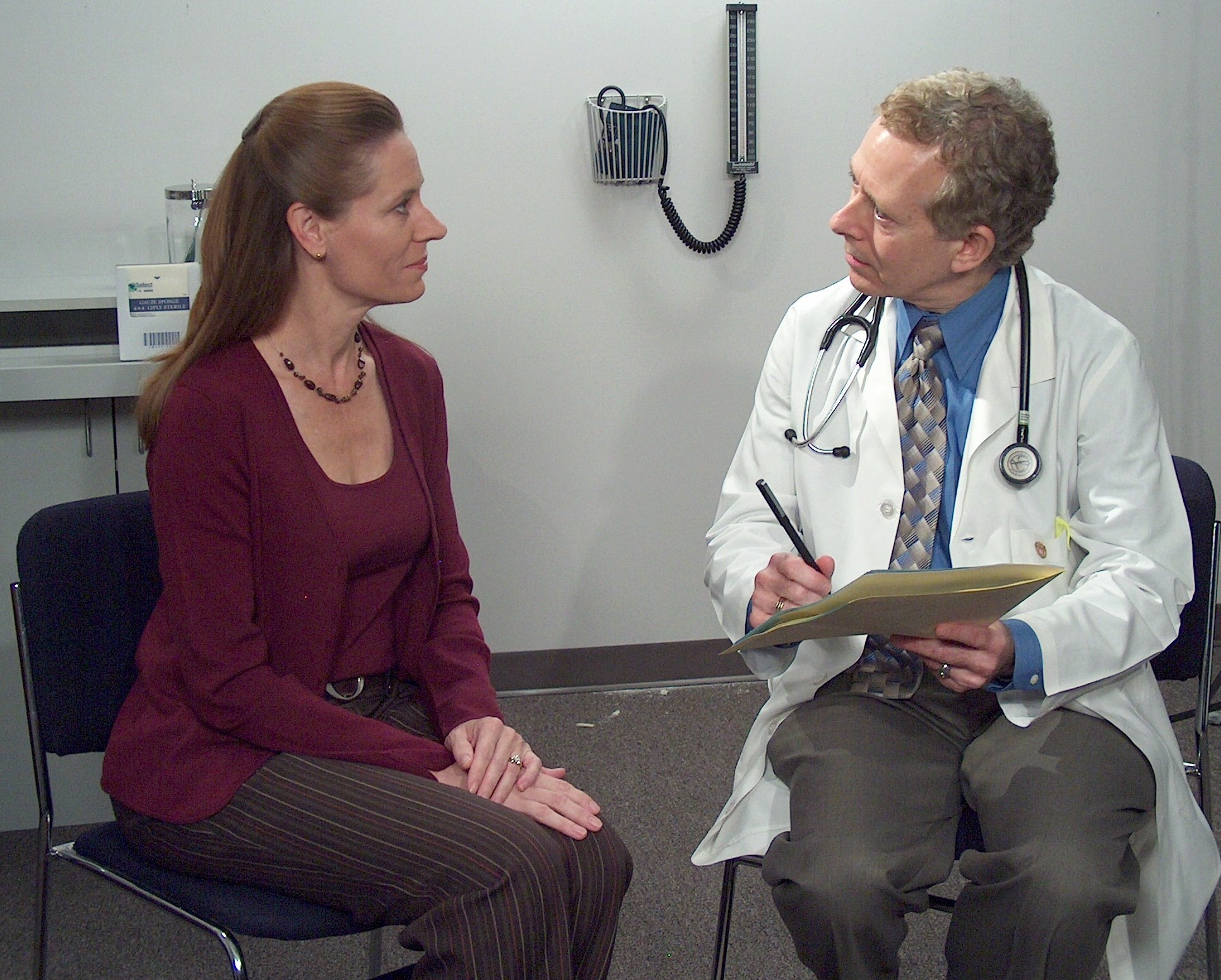 Doctor talking with patient