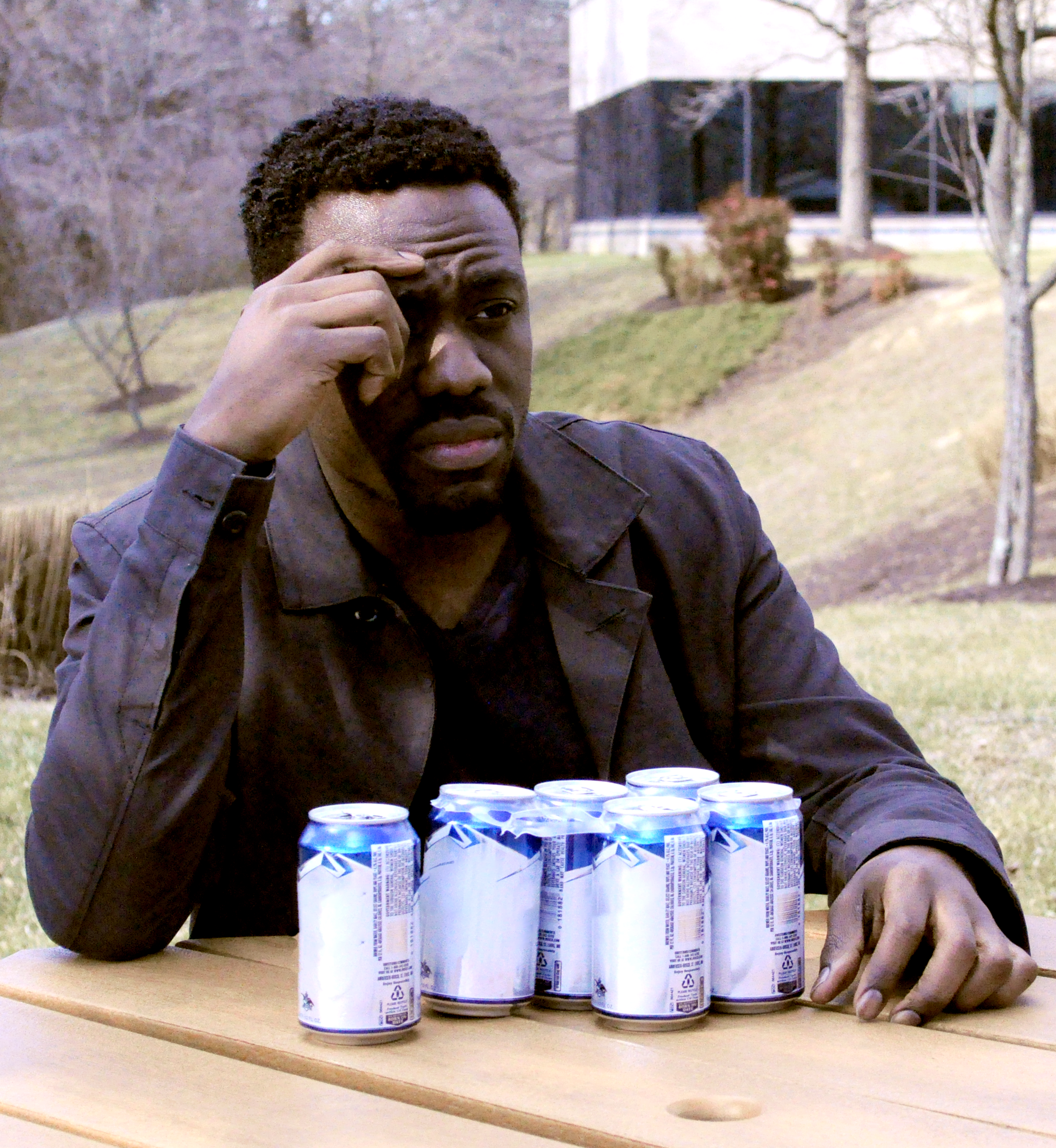 Virtual Human Role-Player Gabe thinking outside with Beer Cans on a table
